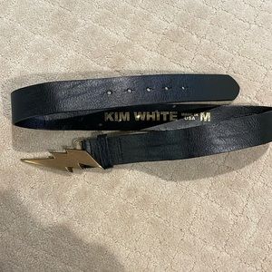 Black leather belt with lightning bolt buckle